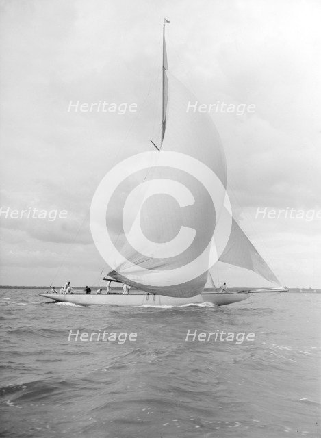 'Istria' sailing downwind under spinnaker, 1912.  Creator: Kirk & Sons of Cowes.