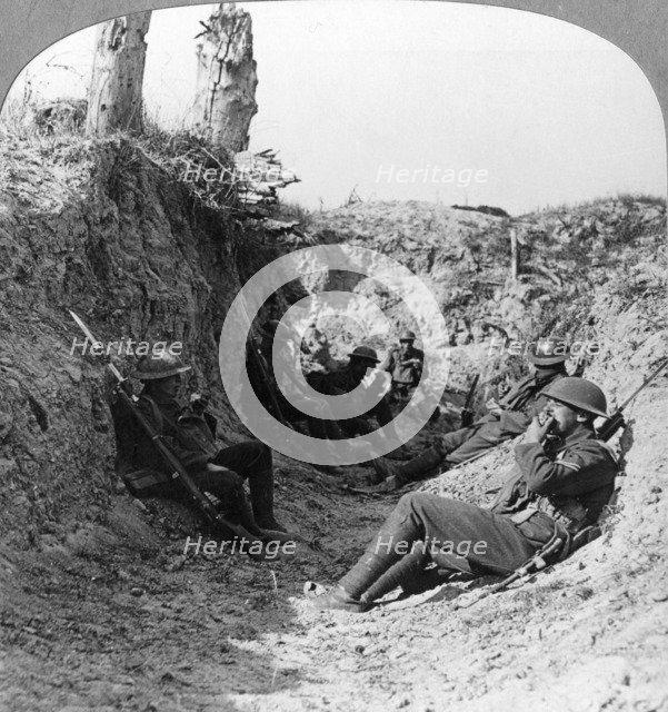 Troops waiting in a trench near Arras, France, World War I, c1914-c1918.  Artist: Realistic Travels Publishers