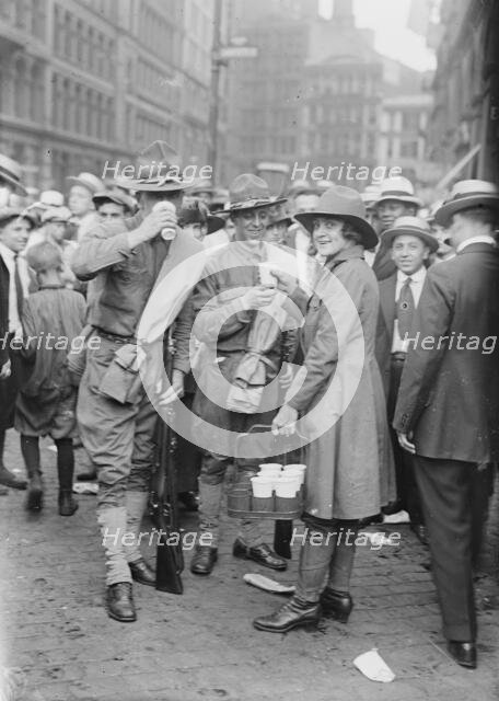 Emma Rencken "watering" soldiers, between c1915 and c1920. Creator: Bain News Service.
