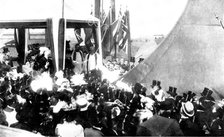 The Duchess of York christening the "Albion", 1898. Creator: Russell & Sons.