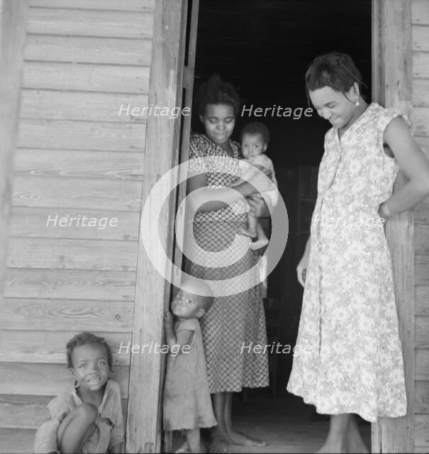 Two tobacco tenant mothers (related) with part of their children, Wake County, North Carolina, 1939. Creator: Dorothea Lange.