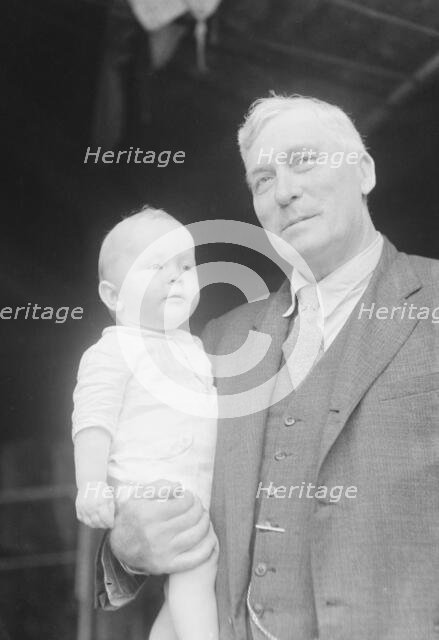 Captain Everett Edwards and baby, portrait photograph, 1933. Creator: Arnold Genthe.