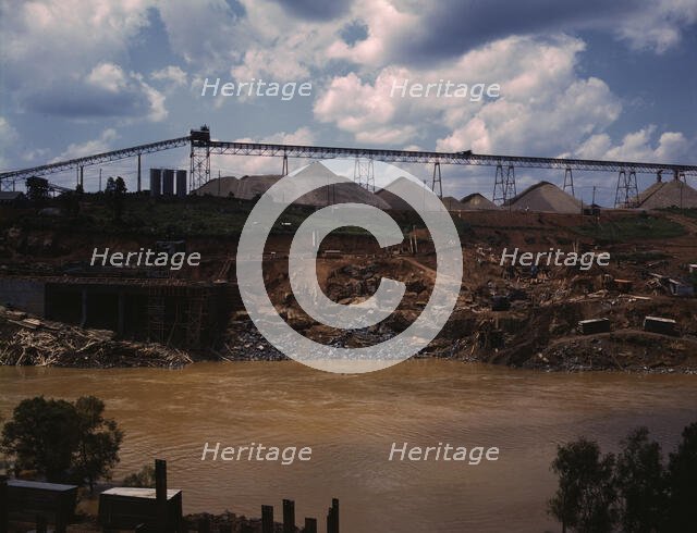Above the construction work, the aggregate storage pile which..., Fort Loudoun Dam, Tenn., 1942. Creator: Alfred T Palmer.