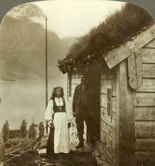 'Young farmers of the Nordfjord country - before their cottage home, Norway', c1905. Creator: Unknown.