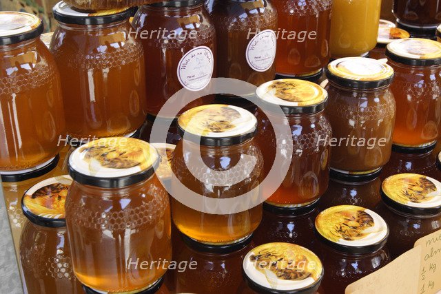 Jars of honey on a market stall, Mallorca, Spain.