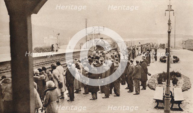 'Sympathetic interest in the Royal Funeral Train at Welwyn Station', 1936. Artist: Unknown.