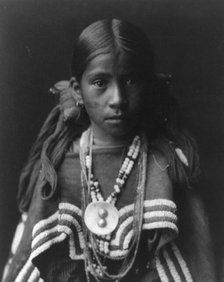 Jicarilla girl in feast dress, c1905. Creator: Edward Sheriff Curtis.