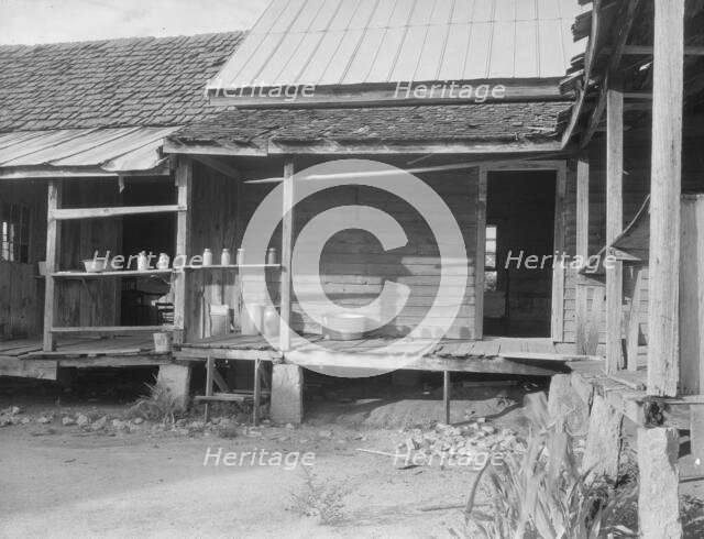 House in which cotton farmer has lived for fifty years, Macon County, Georgia, 1937. Creator: Dorothea Lange.