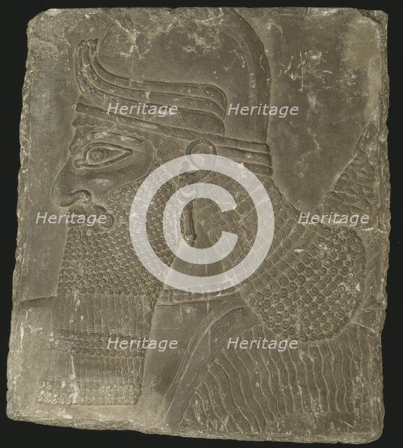 Relief Showing the Head of a Winged Genius, Neo-Assyrian Period, reign of Ashurnasirpal II (883-859  Creator: Unknown.