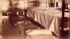 Bellevue Hospital, New York City: a dormitory with bunk beds, 1885-1898. Creator: Unknown.