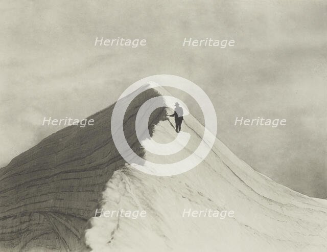 Traversing Annette wind ridge by chief guide F. Milne, Mt Cook district. From the album..., 1920s. Creator: Harry Moult.