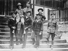 Digby Morton, Phila. Boy Scout, and U.S. Jackies at "Eagle" hut in London, between c1915 and 1918. Creator: Bain News Service.