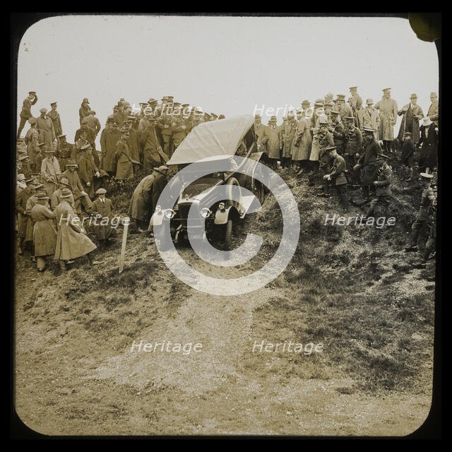A six-wheeled car, possibly an early Morris Commercial 6x4, driving down a slope..., 1926-1929.  Creator: Norman Kingsley Harrison.