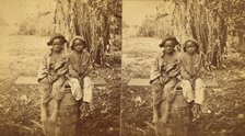 Happy little nig's, [Two boys sitting on a barrel in a field], (1868-1900?). Creator: Unknown.