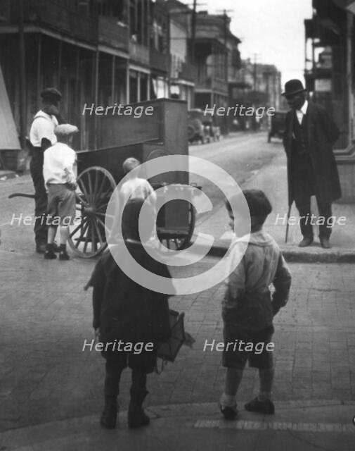Organ grinder, New Orleans, between 1920 and 1926. Creator: Arnold Genthe.