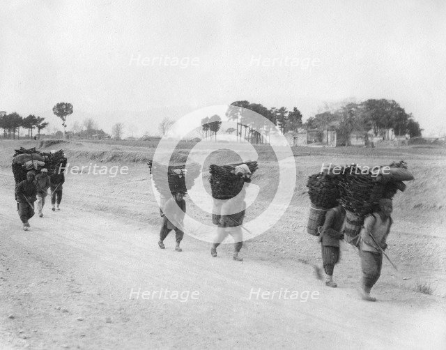 Charcoal bearers on the road to Peking, China, late 19th or early 20th century. Artist: Unknown