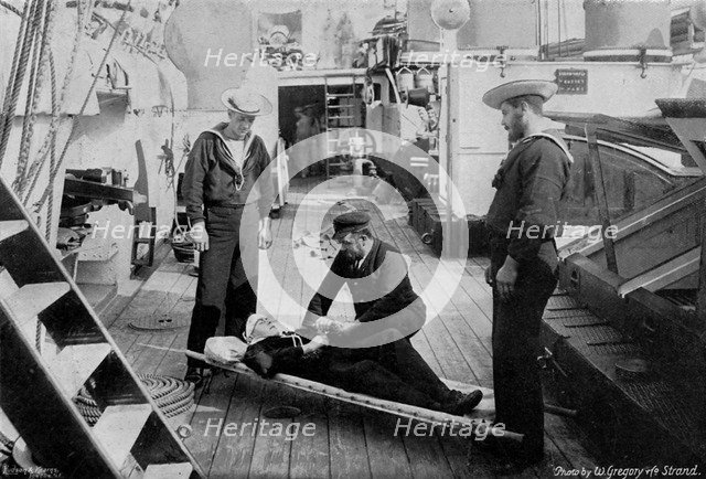 Ambulance drill on board the cruiser HMS 'Tartar', 1896.Artist: W Gregory