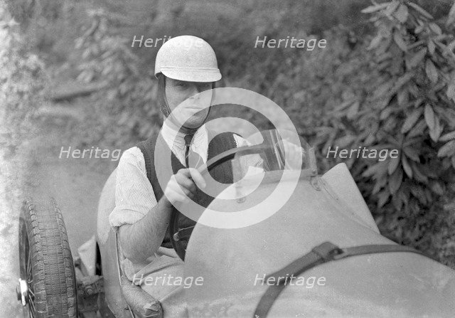 Charles Mortimer behind the wheel of an offset-bodied single-seater MG KN Special, c1930s Artist: Bill Brunell.