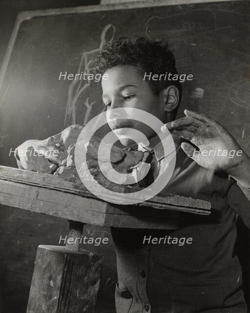 Boy sculpting, Harlem Art Center, 1939. Creator: Berenice Abbott.