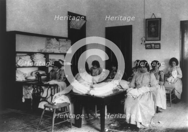Carlisle Indian School, Carlisle, Pa. Clothes mending class, 1901. Creator: Frances Benjamin Johnston.