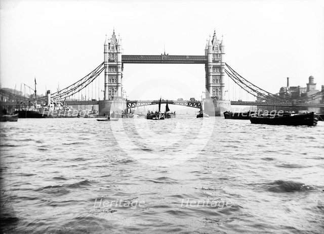 Tower Bridge with bascules closed and barges passing under at high water, London, c1905. Artist: Unknown