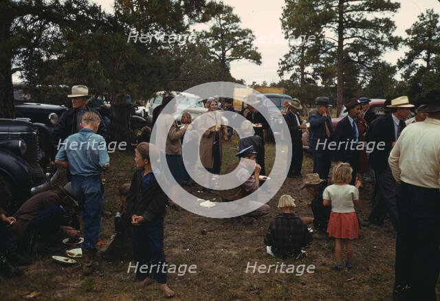 Crowd eating free barbeque dinner at the Pie Town, New Mexico Fair, 1940. Creator: Russell Lee.