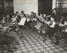 Music classes, violin, 1938. Creator: Aubrey Pollard.