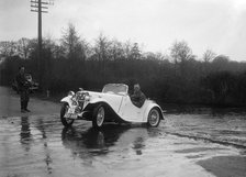 972 cc Singer Le Mans driving through a ford during a motoring trial, 1936. Artist: Bill Brunell.