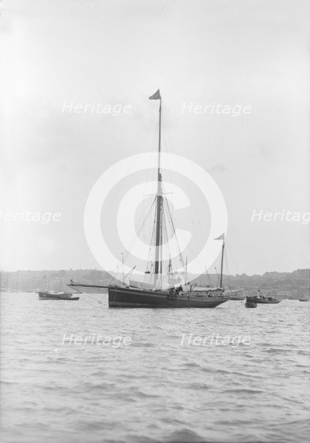 The 40 ton yawl 'Hyacinth' at anchor, 1913. Creator: Kirk & Sons of Cowes.