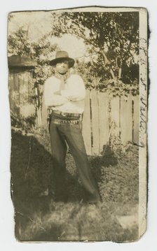 Photographic portrait of a man wearing hat and gun holster, early 20th century. Creator: Unknown.