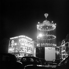 Night scene showing the neon lights of Piccadilly Circus, City of Westminster, c1945-c1965. Artist: SW Rawlings