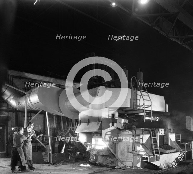 Checking the temperature of molten steel, Sheffield, South Yorkshire, 1964. Artist: Michael Walters