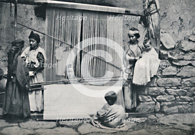 Kabyle weavers and native loom, Northern Algeria, 1912. Artist: Legrand.