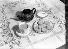 Tea and biscuits, c1955. Creator: Arthur Charles Kirby Ware.