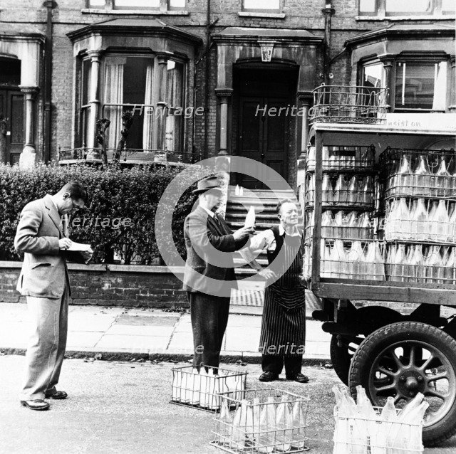 A milkman on his rounds in London, c1950s. Artist: Henry Grant