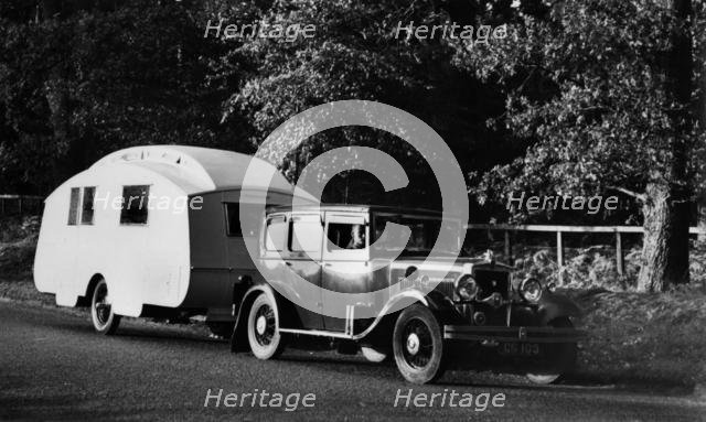 1931 Morris Isis saloon with Winchester caravan. Creator: Unknown.
