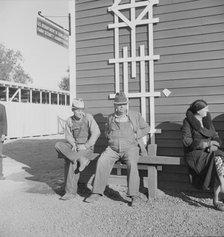 Lineup outside of Farm Security Administration grant office early in the morning, Tulare, CA, 1938. Creator: Dorothea Lange.