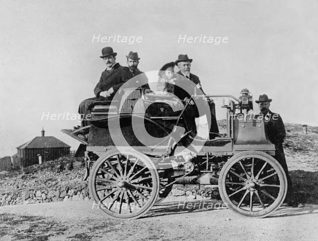 1896 Daimler, Hon. Evelyn Ellis with his daughter and J.S. Critchley, Daimler works manager. Creator: Unknown.