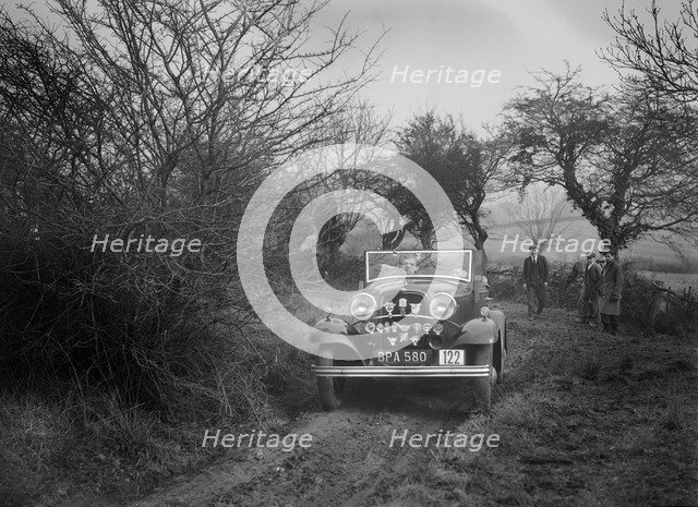 Ford V8 of K Hutchison at the Sunbac Colmore Trial, near Winchcombe, Gloucestershire, 1934. Artist: Bill Brunell.