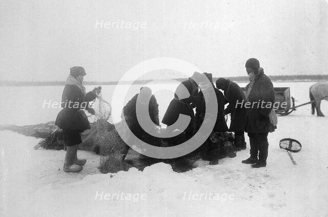 Ice fishing, 1890. Creator: Unknown.