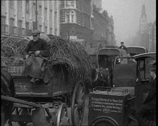 Horses and Carts Riding Through London, 1936. Creator: British Pathe Ltd.