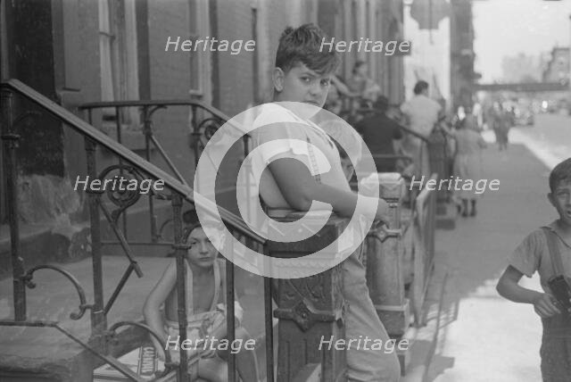 Children playing in the street, 61st Street between 1st and 3rd Avenues, 1938. Creator: Walker Evans.