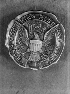 Boys Working Reserve, U.S.A. Badge, 1917. Creator: Harris & Ewing.