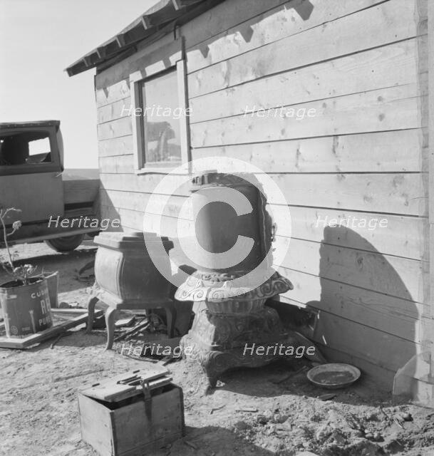 Stoves outside the Browning house being repaired for winter use, Dead Ox Flat, Oregon, 1939. Creator: Dorothea Lange.