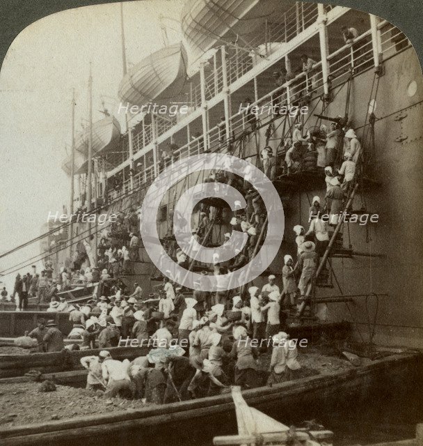 Coaling the Pacific mail SS 'Siberia', at the fortified naval station of Nagasaki, Japan, 1904. Artist: Underwood & Underwood