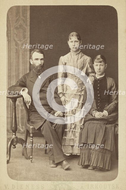 Family portrait of an unidentified man and his two daughters, 1885. Creator: Unknown.