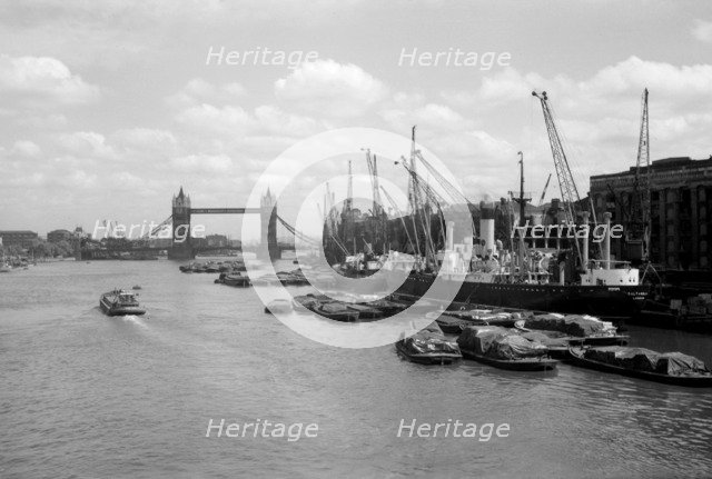 Tower Bridge with shipping in the Pool of London and at Hay's Wharf, Southwark, London, c1945-c1965. Artist: SW Rawlings