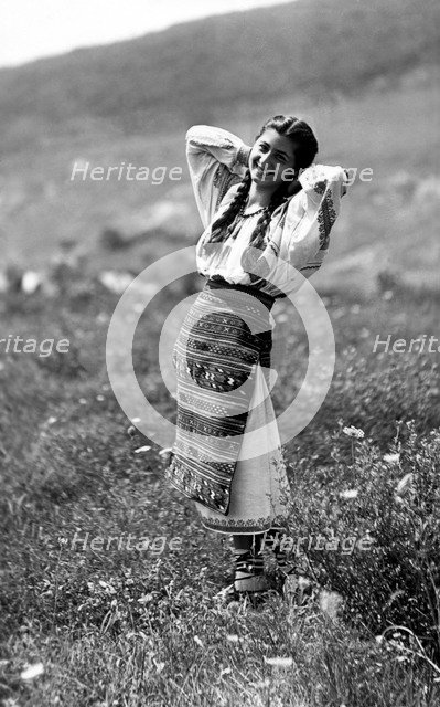 Young woman in traditional costume, Bistrita Valley, Moldavia, north-east Romania, c1920-c1945. Artist: Adolph Chevalier