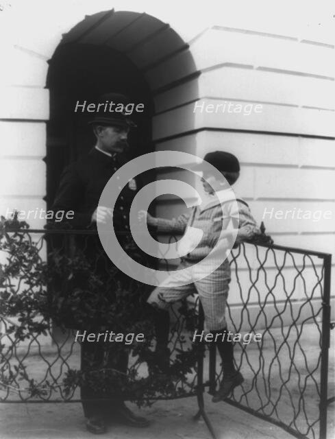 Archie Roosevelt and his friend the policeman, c1902. Creator: Frances Benjamin Johnston.