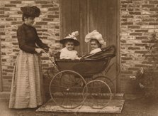 'Woman and children in a pushchair', 1937. Artist: Unknown.